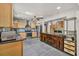 Modern kitchen featuring granite countertops, stainless steel appliances, tile backsplash, and a central island at 1878 Suwanee Roberts Ct, Lawrenceville, GA 30043
