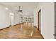Bright and spacious living room with hardwood floors, white walls, large windows, and ceiling fans at 1878 Suwanee Roberts Ct, Lawrenceville, GA 30043