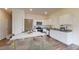A contemporary kitchen featuring stainless steel appliances, white cabinets and granite countertops at 2544 Coventry Street Sw, Atlanta, GA 30331