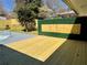 A freshly stained wood deck overlooks the backyard with a modern privacy fence and pool at 6501 Menlo Way, Rex, GA 30273
