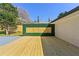 A freshly stained wood deck overlooks the backyard with a modern privacy fence at 6501 Menlo Way, Rex, GA 30273