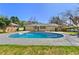 A refreshing inground pool, a fresh stained deck, and large lush green lawn for outdoor enjoyment at 6501 Menlo Way, Rex, GA 30273