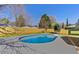 Beautiful backyard featuring a sparkling pool, a fresh stained deck, and wooden privacy fence at 6501 Menlo Way, Rex, GA 30273