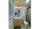 Updated bathroom features tile flooring, a vanity with modern fixtures, and a glass-enclosed shower at 6501 Menlo Way, Rex, GA 30273
