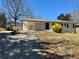 Charming renovated ranch-style home with painted brick, a welcoming front yard, and a covered carport at 6501 Menlo Way, Rex, GA 30273