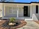 Charming renovated ranch-style home with painted brick and a welcoming front yard at 6501 Menlo Way, Rex, GA 30273