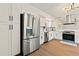 Kitchen featuring stainless steel refrigerator and appliances, light countertops, and stylish cabinets at 6501 Menlo Way, Rex, GA 30273
