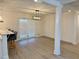 Living room with hardwood floors, sliding glass door, and modern ceiling light at 6501 Menlo Way, Rex, GA 30273