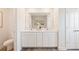 Modern bathroom with double sinks, white cabinetry and tile flooring at 1032 Sutherland Lane (Lot 47), Lawrenceville, GA 30043
