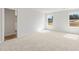 Spacious bedroom with neutral carpet and two bright, natural light-filled windows at 1032 Sutherland Lane (Lot 47), Lawrenceville, GA 30043