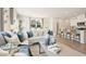 Spacious living room with decor flowing into the kitchen at 1032 Sutherland Lane (Lot 47), Lawrenceville, GA 30043