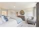 Bright main bedroom featuring a sitting area, large window, and neutral-toned walls at 1032 Sutherland Lane (Lot 47), Lawrenceville, GA 30043