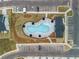 An aerial shot displays the community pool area, complete with outdoor furniture and landscaping at 1032 Sutherland Lane (Lot 47), Lawrenceville, GA 30043