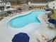 Aerial view of the community pool and lounge area, near the clubhouse and parking lot at 1032 Sutherland Lane (Lot 47), Lawrenceville, GA 30043