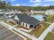 Aerial view of community pool with lounge chairs and umbrellas, set near community clubhouse at 1032 Sutherland Lane (Lot 47), Lawrenceville, GA 30043