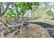 Backyard featuring wooden lounge chairs around a fire pit and a beautiful yard at 10355 Oxford Mill Cir, Johns Creek, GA 30022