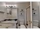 Cozy bathroom features a vanity with granite countertops and a shower-tub combo, offering comfort at 10355 Oxford Mill Cir, Johns Creek, GA 30022