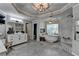 This luxurious bathroom features a modern tub, shower, and and vanities at 10355 Oxford Mill Cir, Johns Creek, GA 30022
