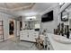 This luxurious bathroom features and vanities, a large mirror, and a walk-in closet at 10355 Oxford Mill Cir, Johns Creek, GA 30022