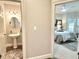 Charming powder room features a pedestal sink and decorative accents at 10355 Oxford Mill Cir, Johns Creek, GA 30022