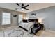 Calm bedroom featuring neutral colors, a ceiling fan, and lots of natural light for a restful space at 10355 Oxford Mill Cir, Johns Creek, GA 30022