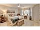 Comfortable bedroom featuring neutral colors, a ceiling fan, and desk area for a cozy retreat at 10355 Oxford Mill Cir, Johns Creek, GA 30022