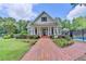 Charming clubhouse with a brick pathway, manicured lawn, and inviting entrance for community gatherings at 10355 Oxford Mill Cir, Johns Creek, GA 30022