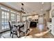 Bright dining area with large windows and an adjacent kitchen, great for Gathering gatherings at 10355 Oxford Mill Cir, Johns Creek, GA 30022