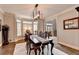 Dining room with a large table, bay window, and view of the front door at 10355 Oxford Mill Cir, Johns Creek, GA 30022