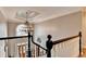 Grand foyer with chandelier and an open view of the home at 10355 Oxford Mill Cir, Johns Creek, GA 30022