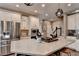 Elegant kitchen showcases stainless steel appliances, a large island, and lots of counter space at 10355 Oxford Mill Cir, Johns Creek, GA 30022