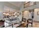 Open concept living room flowing to the kitchen, creating a great space for entertaining at 10355 Oxford Mill Cir, Johns Creek, GA 30022