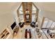 Open living room with soaring ceilings, stone fireplace, hardwood floors and lots of natural light at 10355 Oxford Mill Cir, Johns Creek, GA 30022