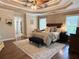 This main bedroom features a trey ceiling, two large windows, and an ensuite bathroom at 10355 Oxford Mill Cir, Johns Creek, GA 30022