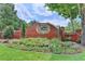 Brick entrance to Oxford Mill community, showcasing landscaping and well-maintained sign at 10355 Oxford Mill Cir, Johns Creek, GA 30022