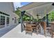 Inviting outdoor seating area featuring wooden tables and chairs, perfect for al fresco dining and socializing at 10355 Oxford Mill Cir, Johns Creek, GA 30022