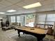 Spacious recreation room features a billiards table and entertainment area, perfect for leisure and hosting at 10355 Oxford Mill Cir, Johns Creek, GA 30022