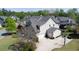 Aerial view showcasing the home's roof, driveway, landscaping, and surroundings at 147 Johnston Farm Ln, Woodstock, GA 30188