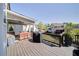 Back deck featuring grill, patio furniture, ceiling fan, and views of backyard at 147 Johnston Farm Ln, Woodstock, GA 30188