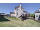 Backyard with deck, stairs, lawn, and privacy fence at 147 Johnston Farm Ln, Woodstock, GA 30188