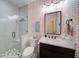 Stylish bathroom featuring a glass-enclosed shower, contemporary fixtures, and designer wallpaper at 147 Johnston Farm Ln, Woodstock, GA 30188