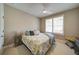 Cozy bedroom with a plush bed, soft lighting, and a serene ambiance for relaxation at 147 Johnston Farm Ln, Woodstock, GA 30188