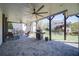 Inviting covered patio with outdoor seating, ceiling fans, brick pavers, and grill at 147 Johnston Farm Ln, Woodstock, GA 30188