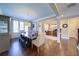 Open-concept dining room with hardwood floors, views to the foyer and living room at 147 Johnston Farm Ln, Woodstock, GA 30188