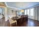 Elegant dining room featuring hardwood floors, plantation shutters and custom china cabinet at 147 Johnston Farm Ln, Woodstock, GA 30188