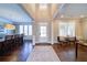 Inviting home foyer with dark hardwood floors, high ceilings, and open access to other rooms at 147 Johnston Farm Ln, Woodstock, GA 30188