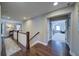 A home hallway features hardwood floors and a view into a bedroom at 147 Johnston Farm Ln, Woodstock, GA 30188