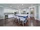 Modern kitchen with white cabinetry, stainless steel appliances, and a large center island at 147 Johnston Farm Ln, Woodstock, GA 30188