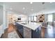 Open concept kitchen with a large island, stainless steel appliances, and hardwood floors at 147 Johnston Farm Ln, Woodstock, GA 30188