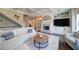 Cozy living room with a fireplace, built-in shelving, and comfortable seating arrangement at 147 Johnston Farm Ln, Woodstock, GA 30188
